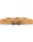 Peluche Amuseables Baguette Jellycat, de face, couchée