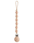 Attache-tétine bébé Luna Blush rose poudré Mushie, pince en silicone et perles rondes
