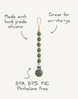 Attache-tétine bébé Luna Faux Wood effet bois Mushie, schéma de la pince et des perles
