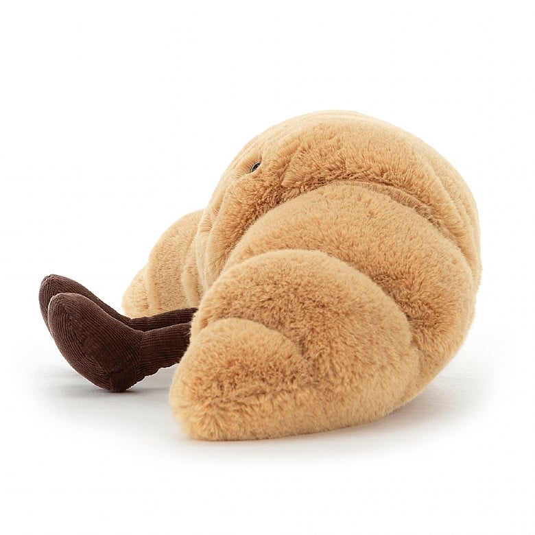 Peluche Amuseables Croissant Small Jellycat, de profil, avec ses bottines