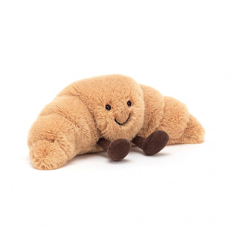 Peluche Amuseables Croissant Small Jellycat, de face, avec son sourire