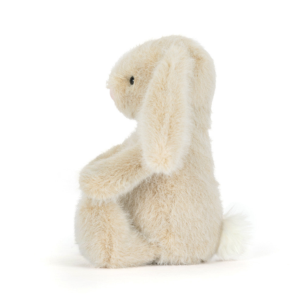 Peluche Wheat Flufflet Bunny Jellycat, de profil, avec ses longues oreilles