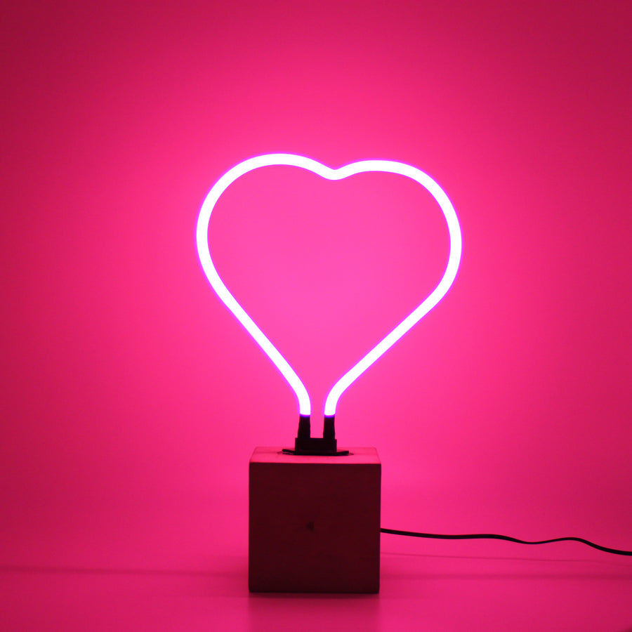 Neon heart with concrete base